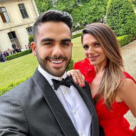 Carlos Adyan is well-dressed in black tuxedo.